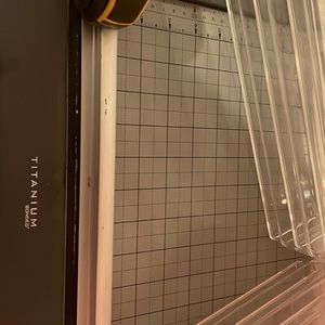 Paper cutter with office supplies